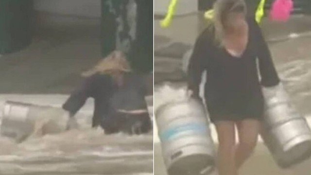 Mulher se joga ao mar para salvar barris de cerveja arrastados durante tempestade. Assista!